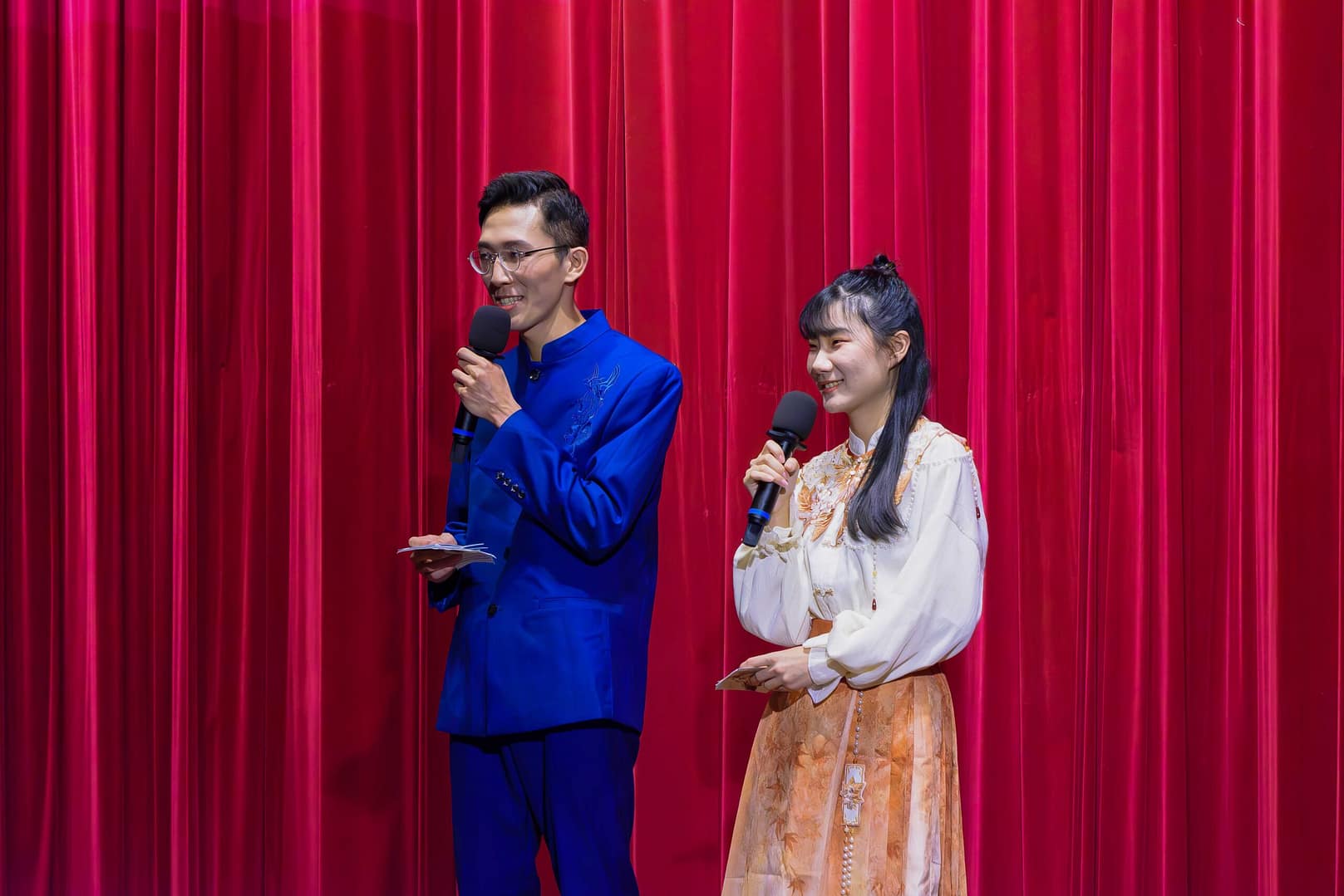 two hosts on the stage