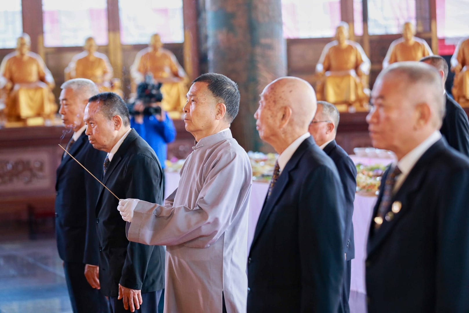 holding incense for worship